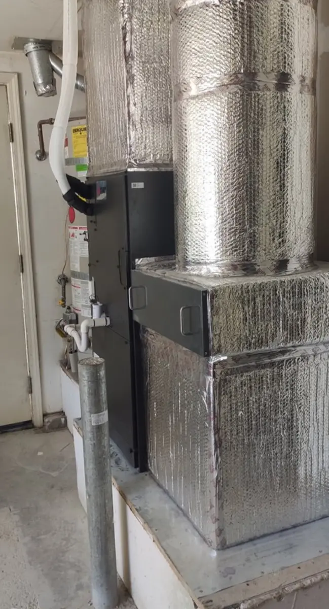 Mitsubishi Electric air handler with insulated plenum and condensate line