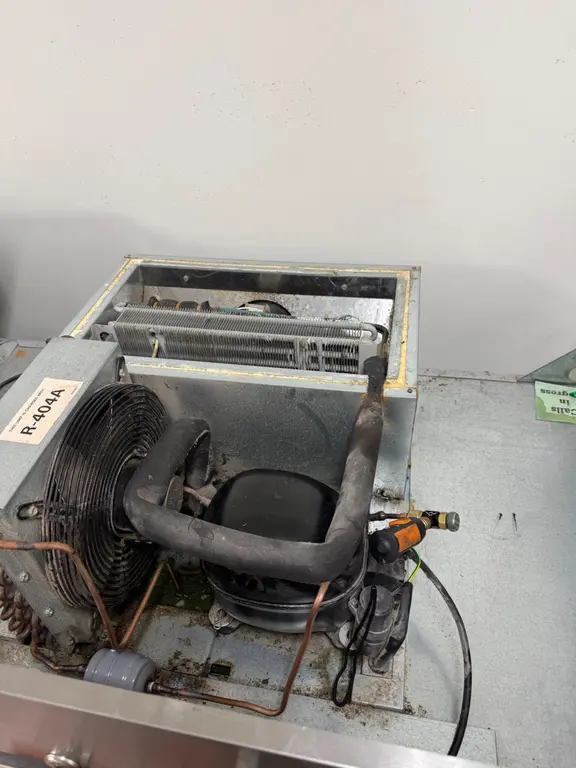 Reach-in compressor and evaporator coil exposed for inspection