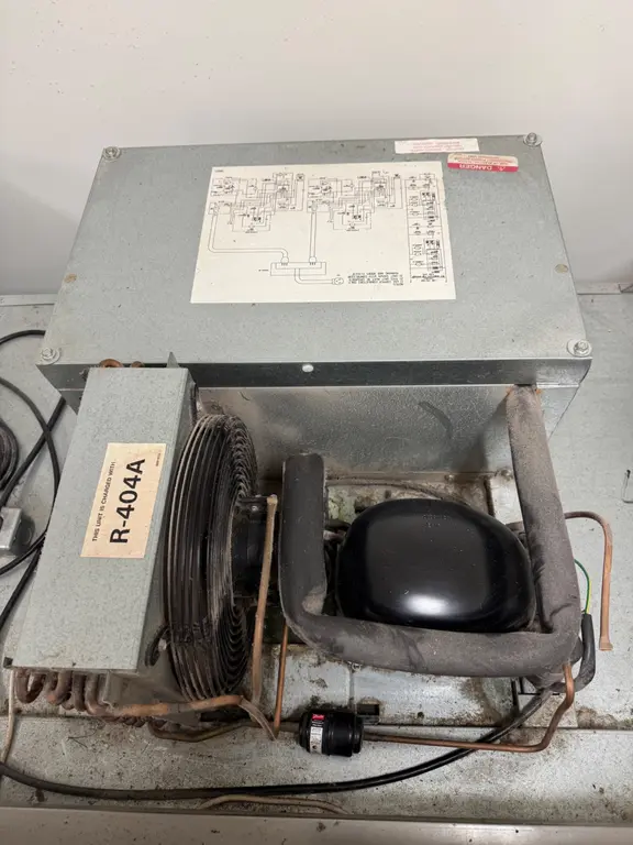 Condensing unit top view with wiring diagram and R-404A label