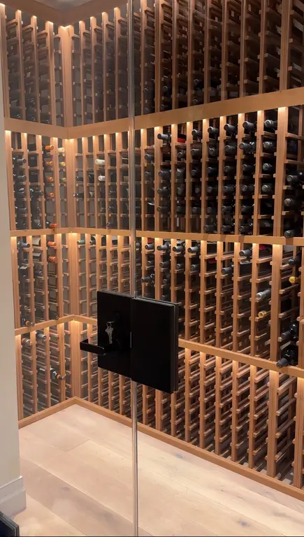 Premium wine cellar with glass door and full bottle collection