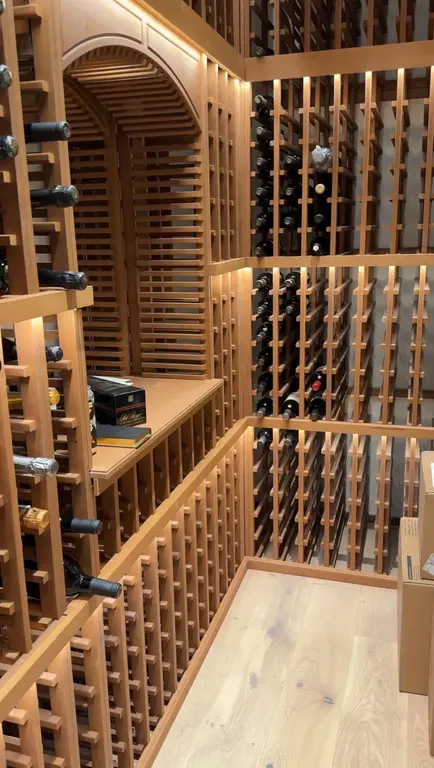 Wine cellar interior with custom cedar racks and arch display