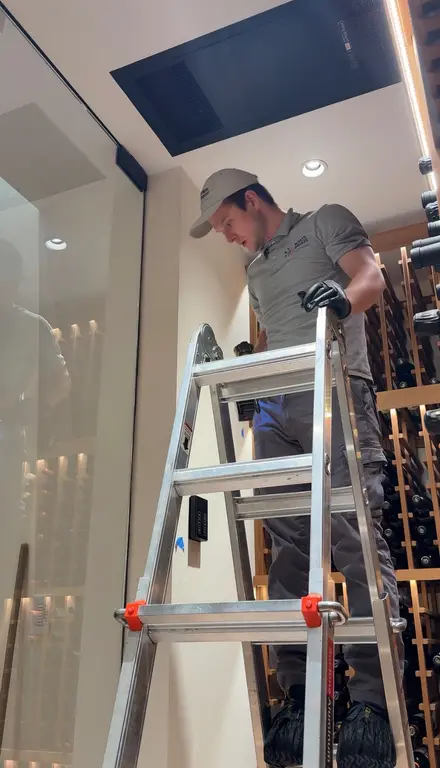 North Breeze technician servicing wine cellar cooling system