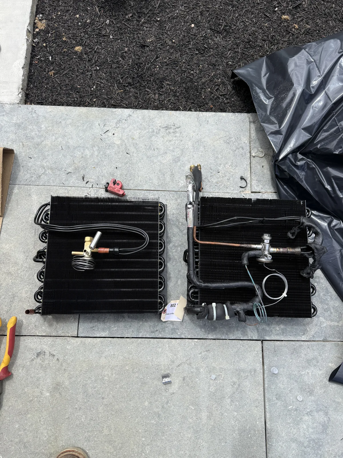 Side-by-side comparison of old failed and new replacement WhisperKOOL evaporator coils